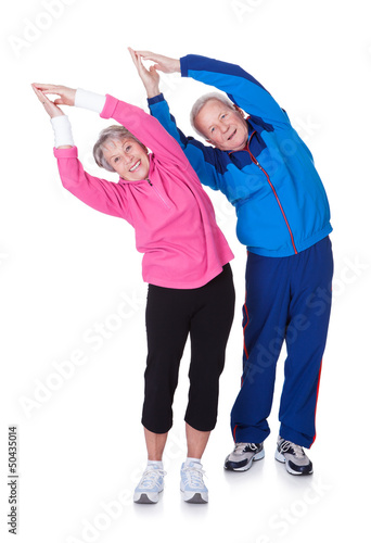 Photo: Portrait Of A Senior Couple Exercising Portrait Of A Senior Couple Exercising