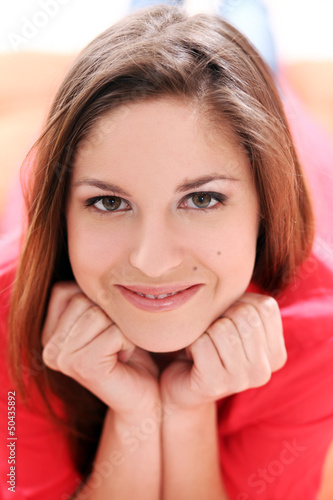 Photo: Portrait of happy young woman Portrait of happy young woman