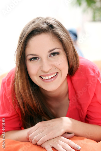 Photo: Portrait of happy young woman Portrait of happy young woman