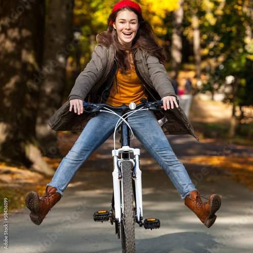 Photo: Girl biking Girl biking