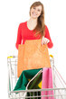 young woman with bags and shopping  trolley