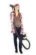 young woman with a vacuum cleaner