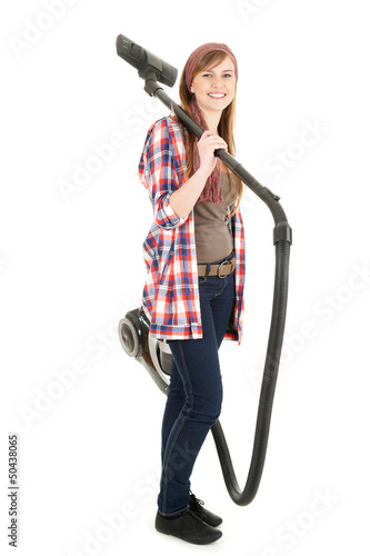 Photo: young woman with a vacuum cleaner young woman with a vacuum cleaner