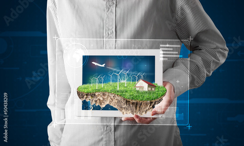 Photo: Businessman presenting a perfect ecology land with a house and w Businessman presenting a perfect ecology land with a house and w