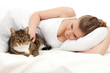 beautiful young woman relaxing in white bedding