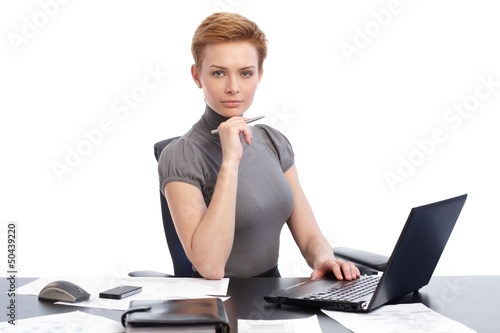 Photo: Attractive businesswoman with laptop Attractive businesswoman with laptop