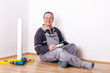 Foto: Man is finished with the home improvement and looks forward Man is finished with the home improvement and looks forward