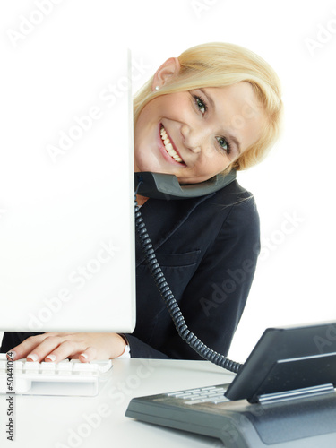 Photo: Female office assistant has fun to call a customer Female office assistant has fun to call a customer