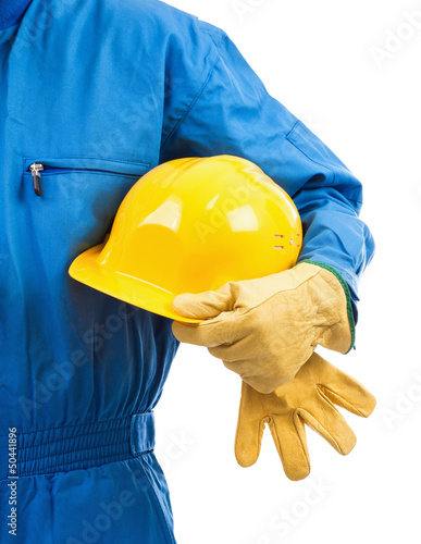 Photo: Yellow hardhat under arm Yellow hardhat under arm