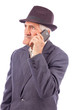 Portrait of an expressive senior talking on phone