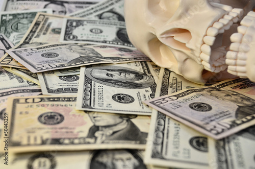 Photo: Skull with dollars background Skull with dollars background
