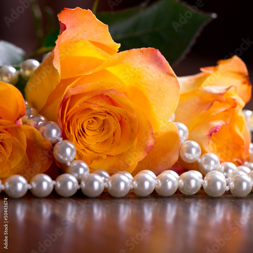 Photo: Orange roses in pearls Orange roses in pearls