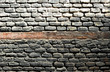 Background, muro de ladrillos negros por el humo