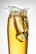 Beer with ice. Splash with drops and foam