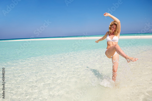 Photo: Woman Enjoying Beach Holiday Woman Enjoying Beach Holiday