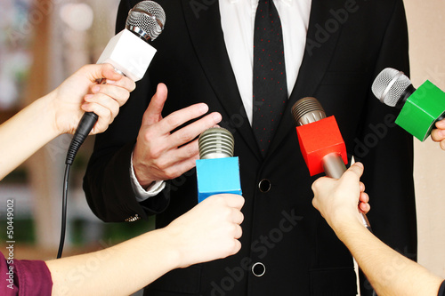 Photo: Conference meeting microphones and businessman Conference meeting microphones and businessman