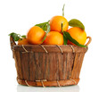 Ripe sweet tangerine with leaves in basket, isolated on white