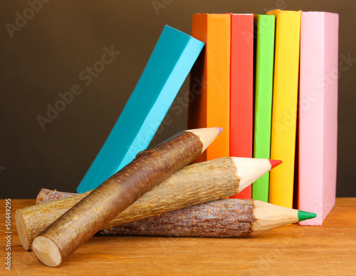 Photo: Colorful wooden pencils with books Colorful wooden pencils with books