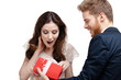 Young man amazes his pretty girlfriend with present 