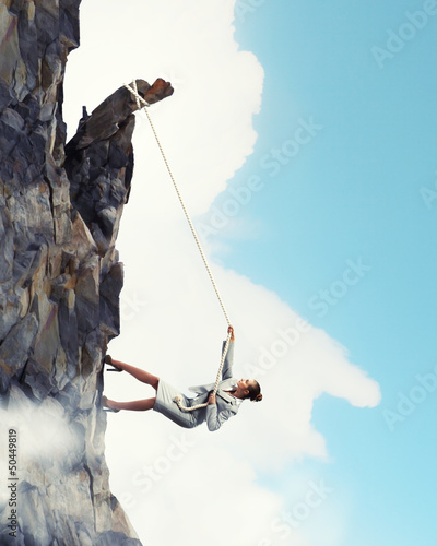 Photo: businesswoman climbing mountain businesswoman climbing mountain