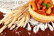 Appetizing village potatoes in bowl on wooden table close-up