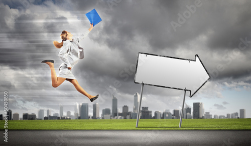 Photo: Businesswoman running on the road Businesswoman running on the road