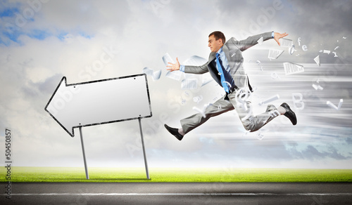 Photo: Businessman running on the road Businessman running on the road
