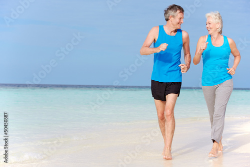 Photo: Senior Couple Running On Beautiful Beach Senior Couple Running On Beautiful Beach