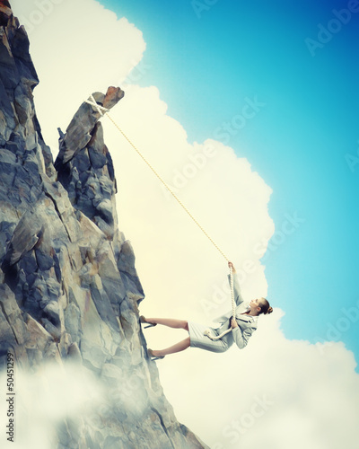 Photo: businesswoman climbing mountain businesswoman climbing mountain