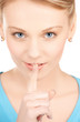 woman with finger on her lips