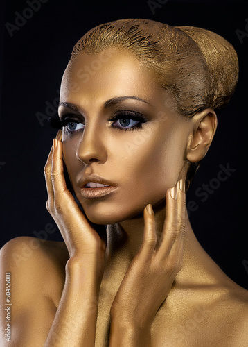 Photo: Gilt. Profile of Surprised Golden Woman's Face. Fantasy Gilt. Profile of Surprised Golden Woman's Face. Fantasy