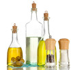 Original glass bottles with salad dressing isolated on white