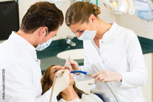 Photo: Patient with Dentist - dental treatment Patient with Dentist - dental treatment
