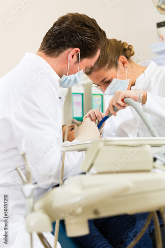 Photo: Patient with Dentist - dental treatment Patient with Dentist - dental treatment