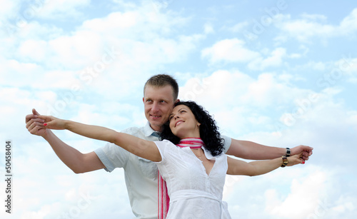 Photo: Beautiful couple celebrating the joy of life Beautiful couple celebrating the joy of life