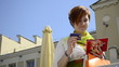 young woman putting a credit card in your wallet
