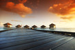 woman in a dress on maldivian sunset