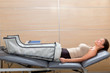 legs pressotherapy machine on woman patient in hospital