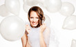 Foto: Smiled happy bride in white balloons Smiled happy bride in white balloons