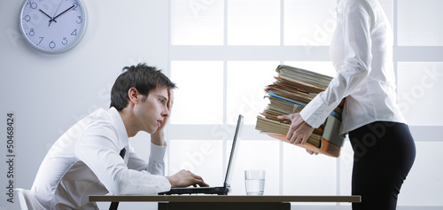 Photo: overworked businessman overworked businessman