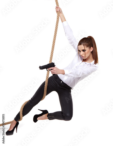 Photo: young beauty woman holding handgun, ready to fight young beauty woman holding handgun, ready to fight