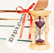 Photo: Diploma and books and hourglass Diploma and books and hourglass