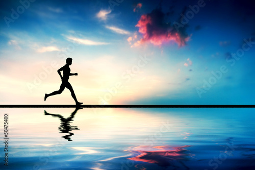 Illustration: Silhouette of man running at sunset. Water reflection Silhouette of man running at sunset. Water reflection