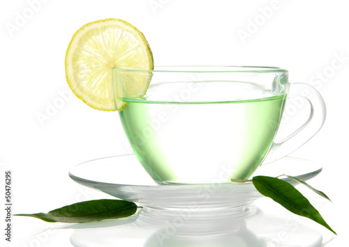 Photo: Transparent cup of green tea with lemon, isolated on white Transparent cup of green tea with lemon, isolated on white