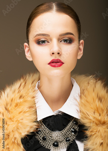 Photo: Glamour. Honorable Fashionable Woman in Rufous Fur Collar Glamour. Honorable Fashionable Woman in Rufous Fur Collar