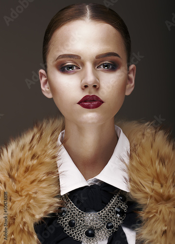 Photo: Arrogance. Stately Luxurious Woman in Wool Collar and Necklace Arrogance. Stately Luxurious Woman in Wool Collar and Necklace