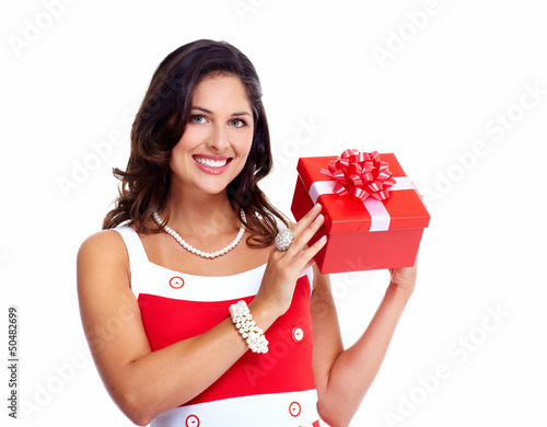 Photo: Beautiful young girl with a Christmas present. Beautiful young girl with a Christmas present.