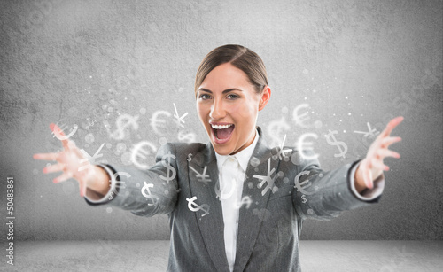 Photo: Investment concept. Pretty business woman with currency symbols. Investment concept. Pretty business woman with currency symbols.