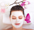 Photo: Young beautiful girl receiving pink facial mask Young beautiful girl receiving pink facial mask