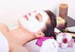 Photo: Beautiful girl receiving pink facial mask Beautiful girl receiving pink facial mask